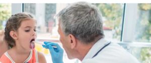 Physician evaluating a child with PANDAS